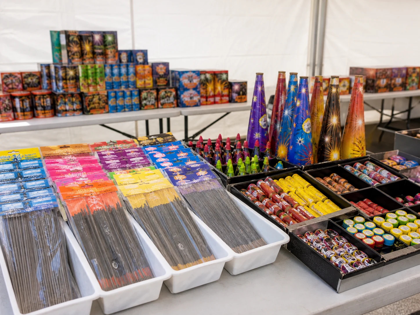 Sparklers, smoke items, and novelty fireworks on a seasonal display table